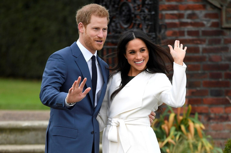 Britain's Prince Harry poses with Meghan Markle in the Sunken Garden of Kensington Palace, London, Britain, November 27, 2017. 