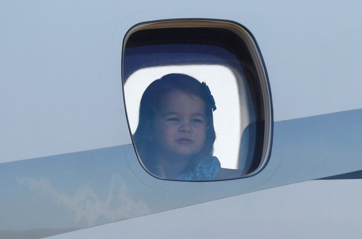 Princess Charlotte looks out of the airplane window at Tegel airport in Berlin, Germany, July 19, 2017.