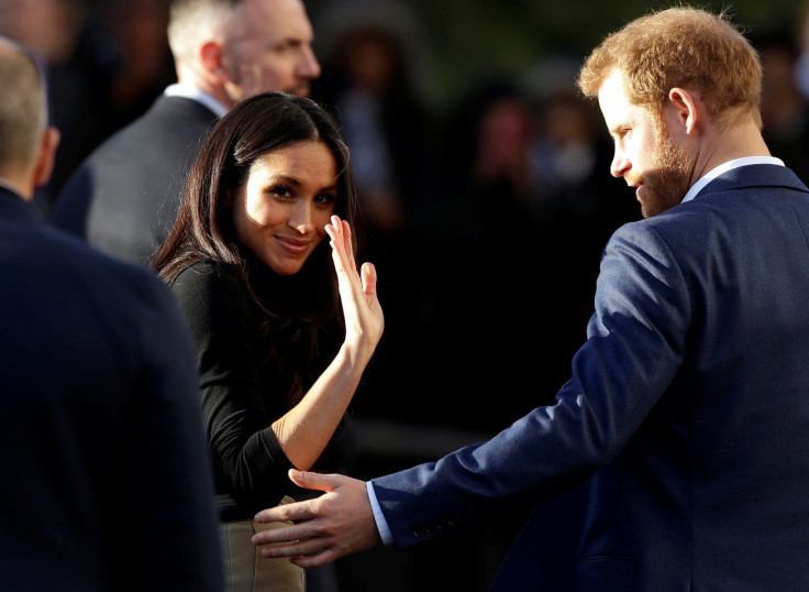 Meghan Markle, accompanied by her fiancee Britain's Prince Harry