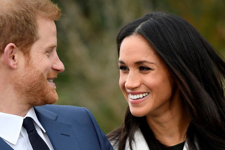 Britain's Prince Harry poses with Meghan Markle