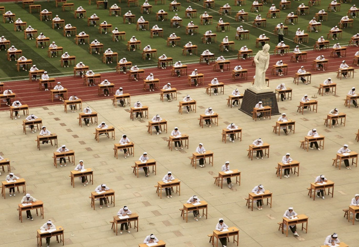 Hundreds of students of the school of nursing take part in an open-air examination at a playground of an vocational college in Baoji, Shaanxi province, China, May 25, 2015.