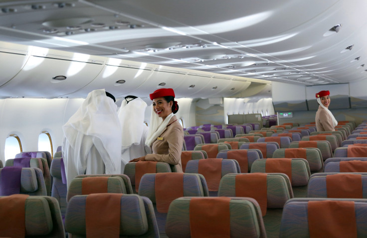 FILE PHOTO: Emirates cabin crew look on as visitors tour an Emirates Airbus A380 during the Dubai Airshow in Dubai, United Arab Emirates November 13, 2017.