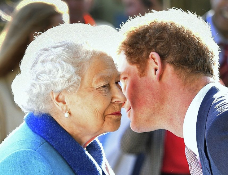 Britain's Queen Elizabeth greets her grandson Prince Harry at the Chelsea Flower Show on press day in London, Britain May 18, 2015.