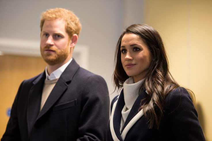 Britain's Prince Harry and his fiancee Meghan Markle watch Coach Core apprentices taking part in a training masterclass exercise at Nechells Wellbeing Centre in Birmingham, Britain, March 8, 2018.