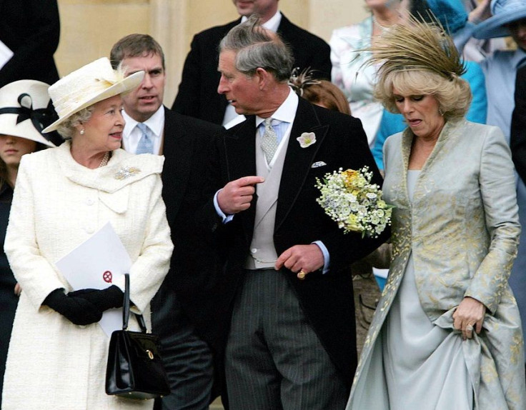 Queen Elizabeth stands behind Prince Charles and Camilla Parker Bowles