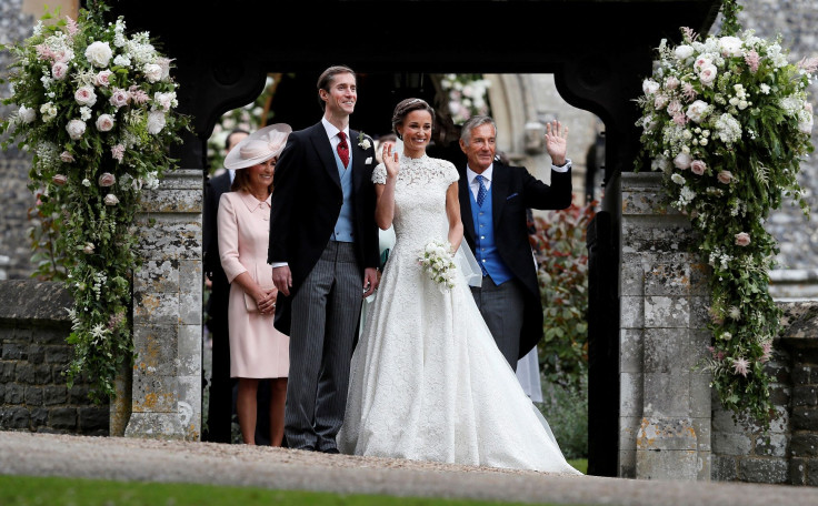 David Matthews (right) waves to well-wishers at the wedding of his son James Matthews and Pippa Middleton
