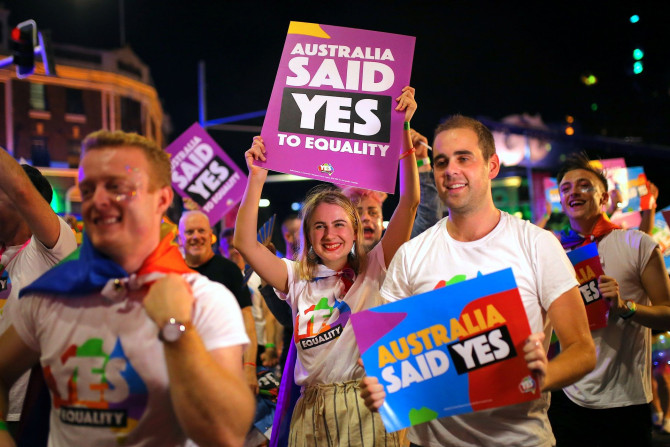 Participants hold banners regarding same-sex marriage during the 40th anniversary of the Sydney Gay and Lesbian Mardi Gras Parade in central Sydney, Australia March 3, 2018.