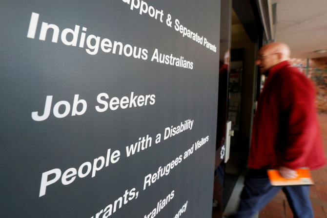 A man walks into a Centrelink, part of the Australian government's department of human services where job seekers search for employment, in a Sydney suburb, August 7, 2014.