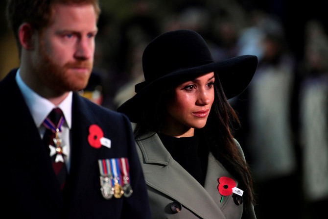 Britain's Prince Harry and his fiancee Meghan Markle attend the Dawn Service at Wellington Arch to commemorate Anzac Day in London, Britain, April 25, 2018.