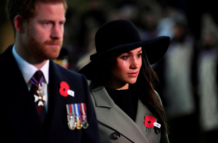 Britain's Prince Harry and his fiancee Meghan Markle attend the Dawn Service at Wellington Arch to commemorate Anzac Day in London, Britain, April 25, 2018.