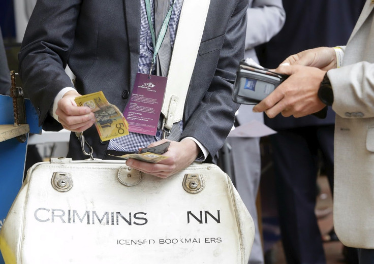 Bets being placed with bookmakers during the Melbourne Cup race day at Flemington Racecourse in Melbourne, Victoria November 3, 2015.