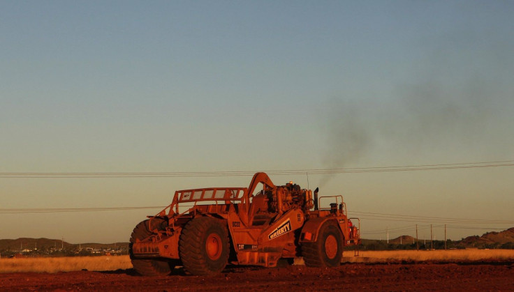 A man operates an earthmover in a new industrial area in Karratha at the Pilbarra region in Western Australia April 19, 2011. Picture taken April 19, 2011.