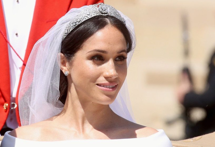 Meghan, Duchess of Sussex leaves Windsor Castle in the Ascot Landau carriage during a procession after getting married at St Georges Chapel on May 19, 2018  in Windsor, Britain, May 19, 2018.