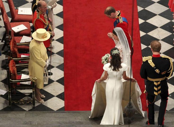 Britain's Prince William and his wife Catherine, Duchess of Cambridge, bow their heads to Queen Elizabeth during their wedding ceremony at Westminster Abbey in London April 29, 2011.