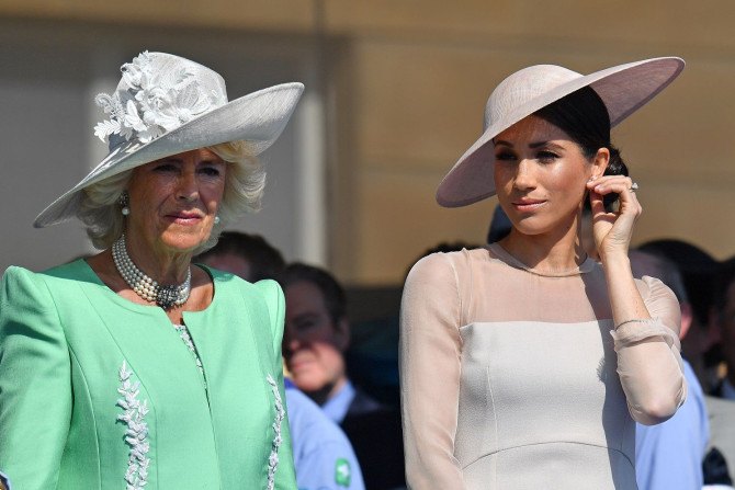 Meghan, Duchess of Sussex attends a garden party at Buckingham Palace, with Camilla the Duchess of Cornwall, in London, Britain May 22, 2018.