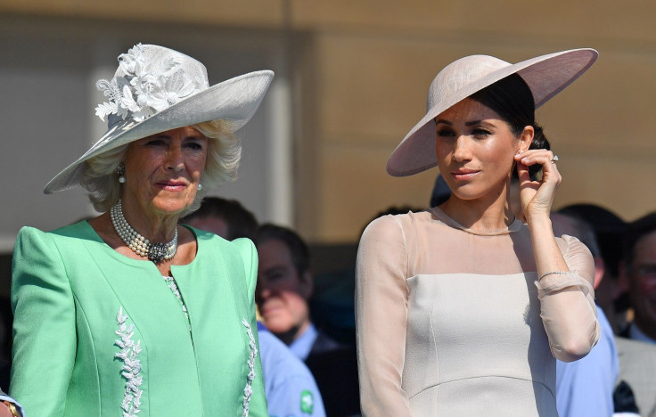 Meghan, Duchess of Sussex attends a garden party at Buckingham Palace, with Camilla the Duchess of Cornwall, in London, Britain May 22, 2018.