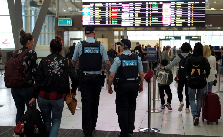Australia Federal Police officers patrol the security lines at Sydney's Domestic Airport in Australia, July 31, 2017,