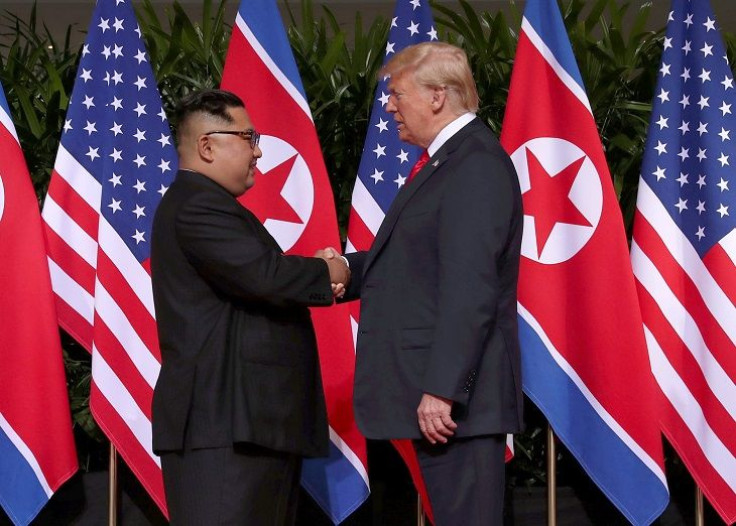 U.S. President Donald Trump shakes hands with North Korean leader Kim Jong Un