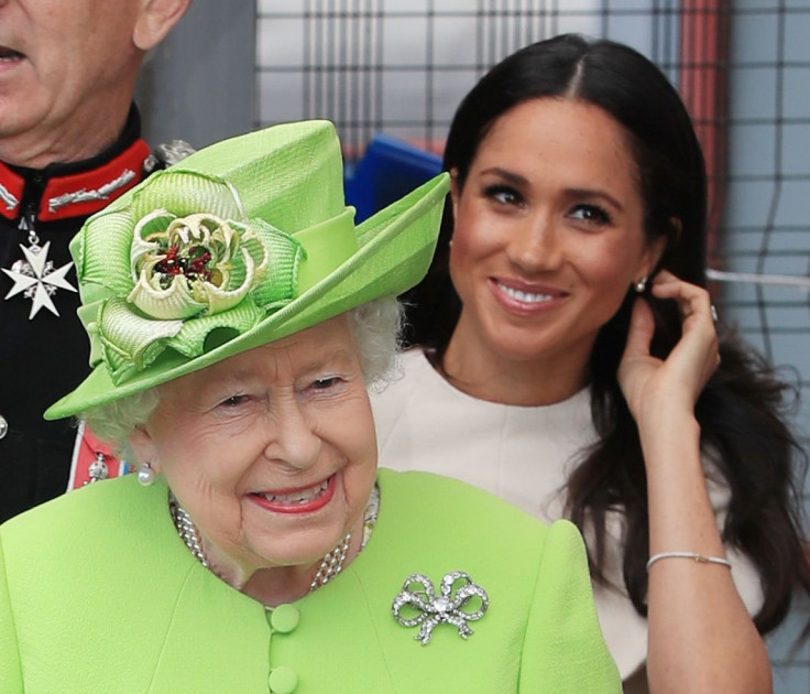 Britain's Queen Elizabeth and Meghan, the Duchess of Sussex, arrive in Runcorn, June 14, 2018.