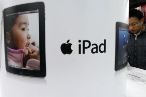A shopper looks at an Apple Inc iPad at an electronic shop in Tokyo December 27, 2010.