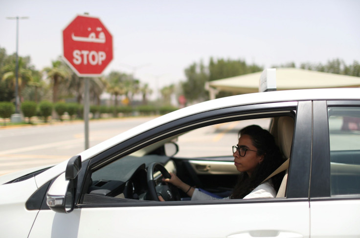 Trainee Maria al-Faraj stops the car at a stop sign during a driving lesson with her instructor at Saudi Aramco Driving Center in Dhahran, Saudi Arabia, June 6, 2018.