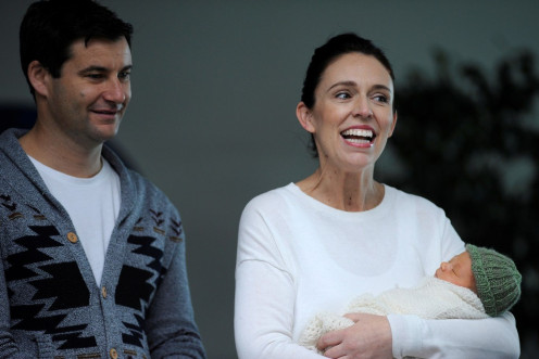 New Zealand Prime Minister Jacinda Ardern carries her newborn baby Neve Te Aroha Ardern Gayford with her partner Clarke Gayfor as she walks out of the Auckland Hospital in New Zealand, June 24, 2018.