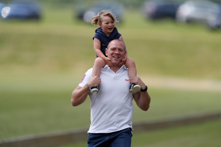 Mike Tindall carries his daughter, Mia, on his shoulders at the Maserati Royal Charity Polo Trophy at the Beaufort Polo Club in Tetbury, Britain June 11, 2017.