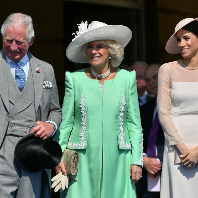 Meghan, Duchess of Sussex attends a garden party at Buckingham Palace, with Camilla the Duchess of Cornwall and Prince Charles, in London, Britain May 22, 2018.