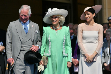 Meghan, Duchess of Sussex attends a garden party at Buckingham Palace, with Camilla the Duchess of Cornwall and Prince Charles, in London, Britain May 22, 2018.