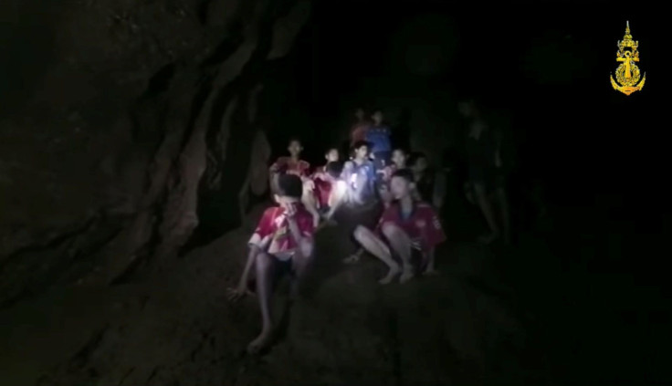 Boys from an under-16 soccer team and their coach wait to be rescued after they were trapped inside a flooded cave in Chiang Rai, Thailand, July 3, 2018, in this still image taken from a Thai Navy Seal handout video.