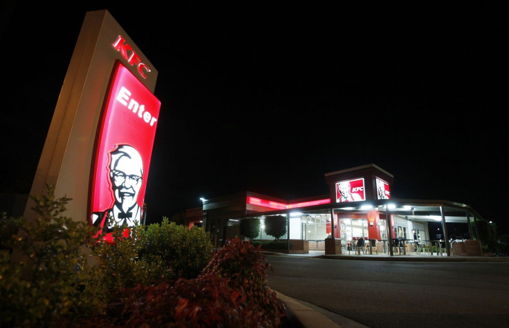 An illuminated sign stands at the entrance to a KFC outlet in the Sydney suburb of Villawood April 27, 2012.