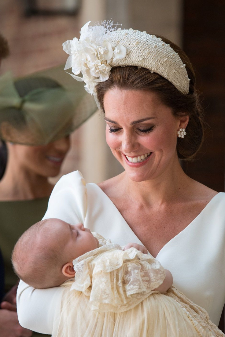 Britain's Catherine, the Duchess of Cambridge, carries Prince Louis