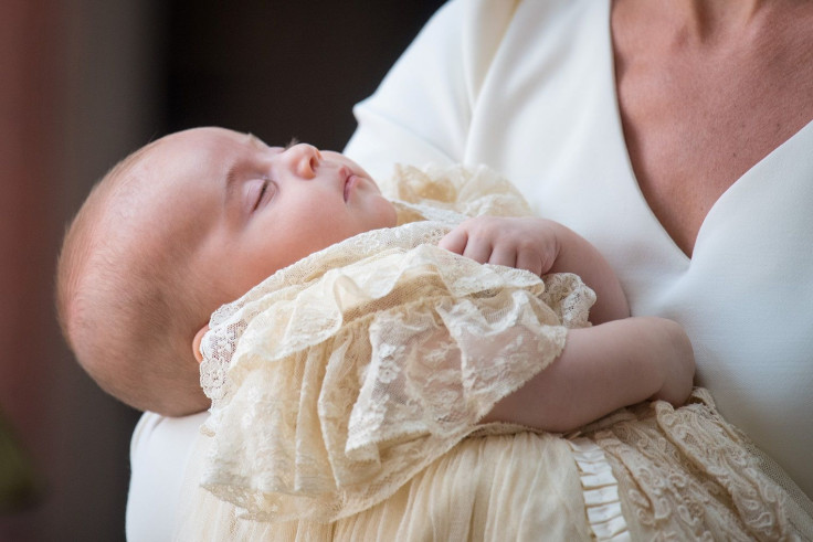 Britain's Catherine, the Duchess of Cambridge, carries Prince Louis