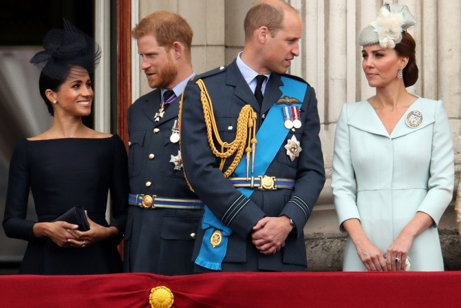 Britain's Meghan, Duchess of Sussex, Prince Harry, Prince William, Catherine, Duchess of Cambridge  stand on the balcony of Buckingham Palace as they watch a fly past to 