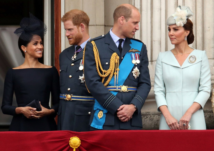 Britain's Meghan, Duchess of Sussex, Prince Harry, Prince William, Catherine, Duchess of Cambridge  stand on the balcony of Buckingham Palace as they watch a fly past to 