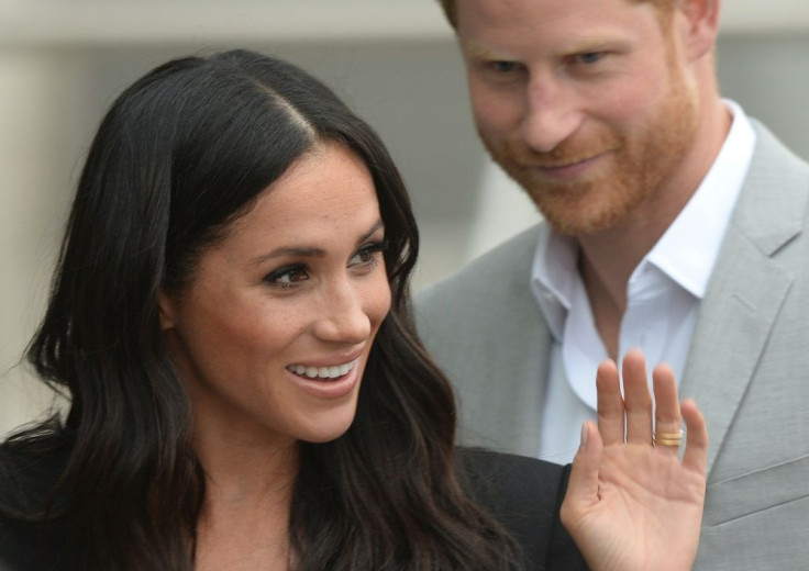 Britain's Prince Harry and Meghan, the Duchess of Sussex, waves at well-wishers during a walkabout in Dublin, Ireland, July 11, 2018.