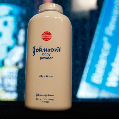 A bottle of Johnson and Johnson Baby Powder is seen in a photo illustration taken in New York, February 24, 2016.