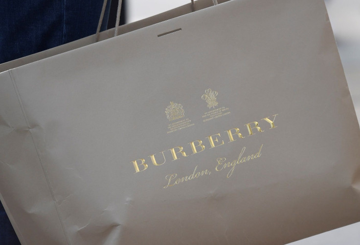 A shopper carries a Burberry bag in central London, Britain, November 3, 2017. Picture taken November 3, 2017.