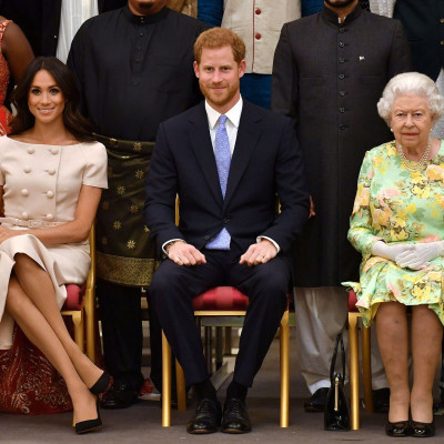 Britain's Queen Elizabeth, Prince Harry and Meghan, the Duchess of Sussex