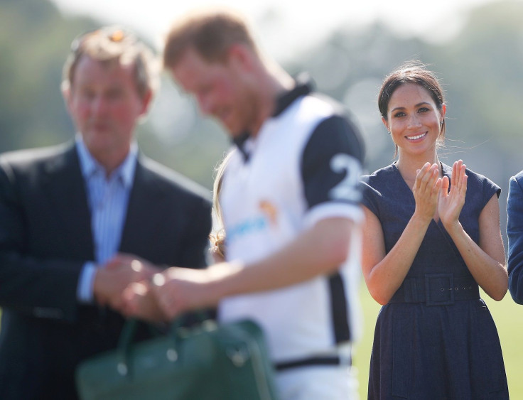 Britain's Prince Harry and his wife Meghan the Duchess of Sussex attend the presentation after a charity polo match in Windsor, Britain, July 26, 2018.
