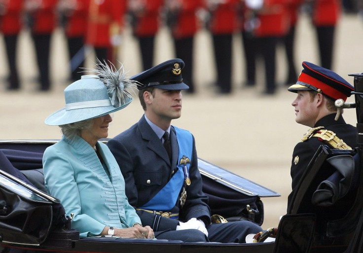 Britain's Camilla, Duchess of Cornwall, sits with Princes William and Harry (R)