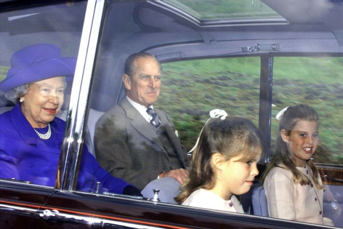 The Queen and Prince Philip, accompanied by Princesses Eugenie (2ndR) and Beatrice (R) arrive at Crathie church near Balmoral for Sunday service August 30.