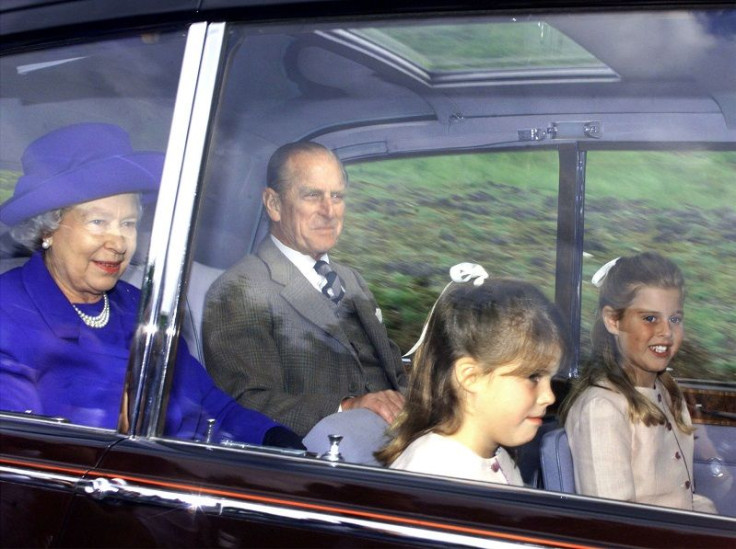 The Queen and Prince Philip, accompanied by Princesses Eugenie (2ndR) and Beatrice (R) arrive at Crathie church near Balmoral for Sunday service August 30.