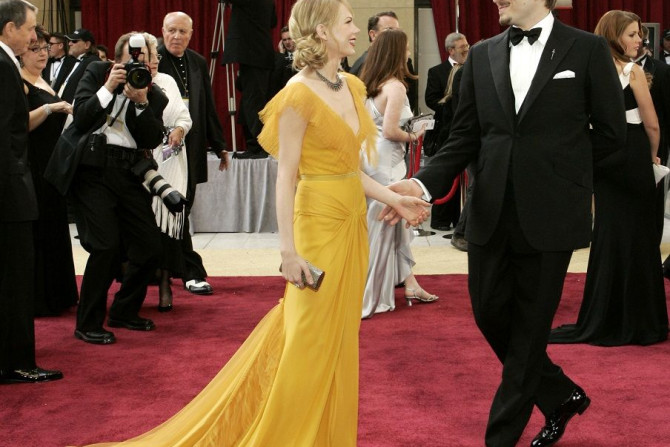 Actor Michelle Williams (L) dances on the red carpet with her fiance Heath Ledger