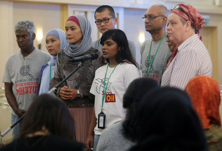 Family members speak to the media after an MH370 closed door meeting in Putrajaya, Malaysia July 30, 2018.