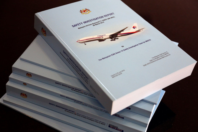 A stack of MH370 safety investigation report booklets is pictured at a closed door meeting with family members in Putrajaya, Malaysia July 30, 2018.