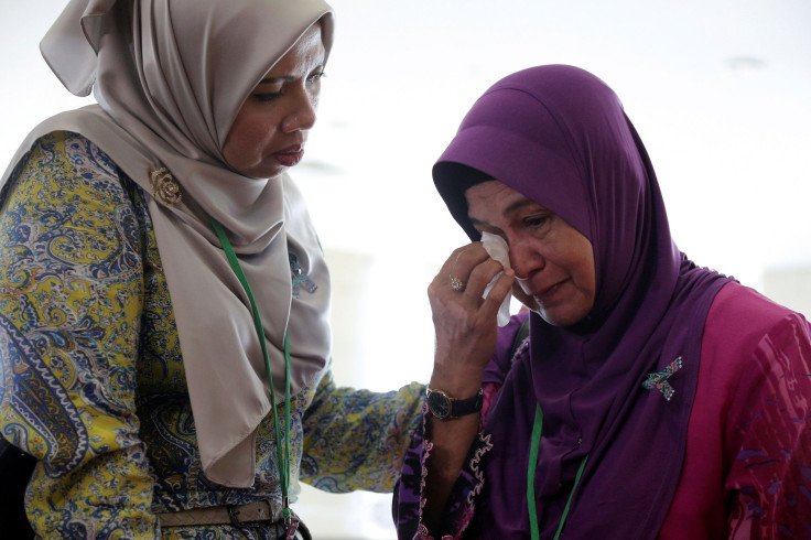 A family member cries after an MH370 closed door meeting in Putrajaya, Malaysia July 30, 2018.