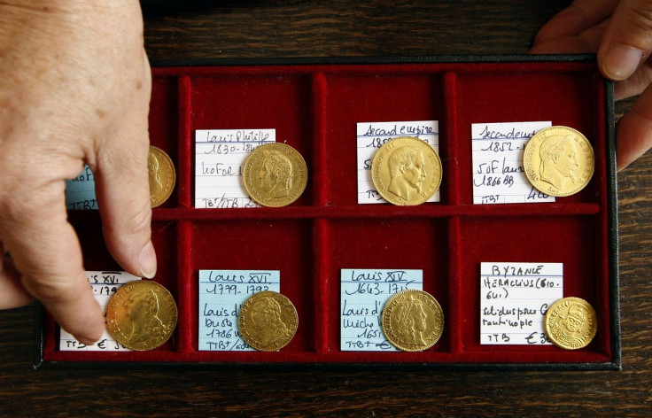 A coin dealer displays gold coins in a shop in Nice, southern France, October 8, 2008.