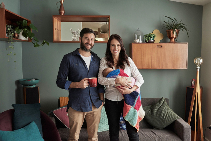 New Zealand Prime Minister Jacinda Ardern, carrying her newborn baby Neve Te Aroha Ardern Gayford, poses with her partner Clarke Gayford for a photo, in New Zealand, August 1, 2018.