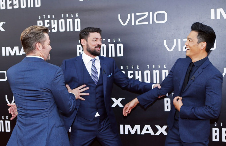 Actors Chris Pine (L), Karl Urban and John Cho